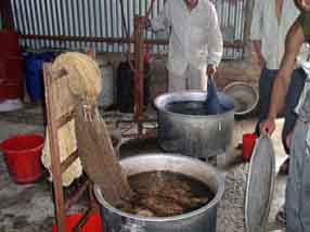Yarn being dyed in vats